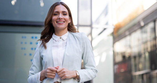 New Manager in a professional business women's outfit on her way to a meeting.